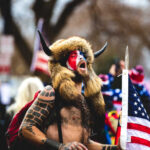 New Footage Shows Capitol Officers Leading ‘Q-Anon Shaman’ To Senate Chambers