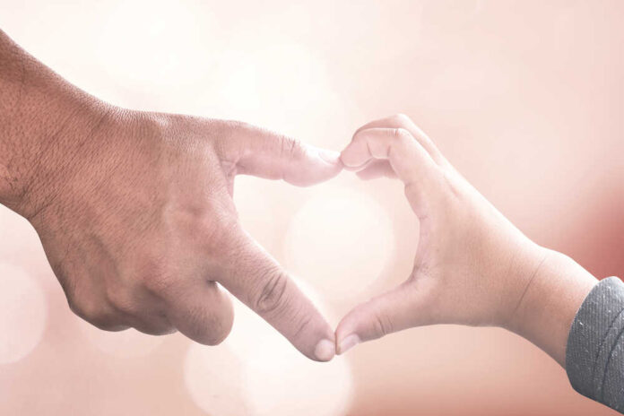 International,Human,Solidarity,Day,Concept:,Father,And,Son,Hands,Make