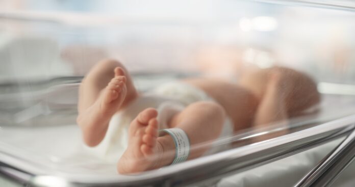 Cute,Little,Caucasian,Newborn,Baby,Lying,In,Bassinet,In,A